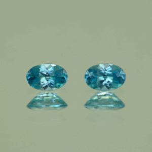 BlueZircon oval pair 6.0x4.0mm 1.30cts H zn7540 scaled 1