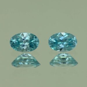 BlueZircon oval pair 6.0x4.0mm 1.35cts H zn4770