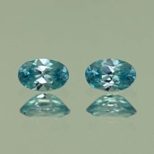 BlueZircon oval pair 6.0x4.0mm 1.35cts H zn4771
