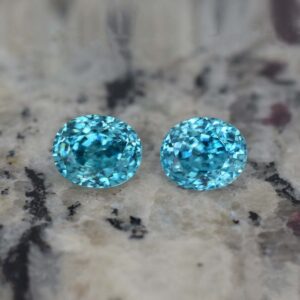 BlueZircon oval pair 8.1x6.7mm 7.73cts H zn819 b crop SOLD
