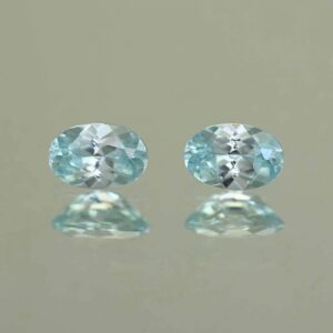 IceBlueZircon oval pair 6.0x4.0mm 1.34cts H zn7090 scaled 1