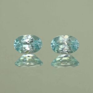 IceBlueZircon oval pair 6.5x4.5mm 1.87cts H zn7092 scaled 1