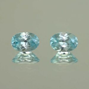 IceBlueZircon oval pair 7.0x5.0mm 2.29cts H zn7094 scaled 1
