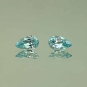 IceBlueZircon pear pair 10.0x6.0mm 4.49cts H zn7473 scaled 1