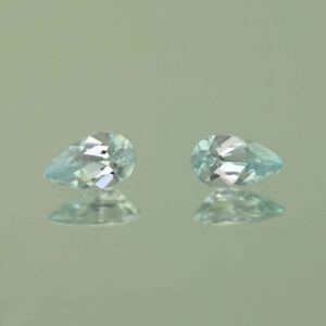 IceBlueZircon pear pair 7.0x4.0mm 1.40cts H zn7463 scaled 1
