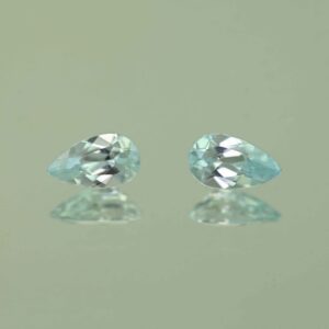IceBlueZircon pear pair 7.0x4.0mm 1.43cts H zn7464 scaled 1