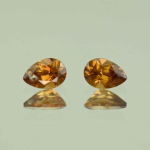 YellowOrangeZircon pear pair 6.5x4.5mm 1.59cts N zn7737 scaled 1