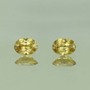 YellowZircon oval pair 7.0x5.0mm 2.18cts H zn3805