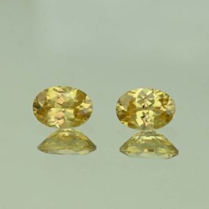YellowZircon oval pair 7.0x5.0mm 2.23cts H zn3806