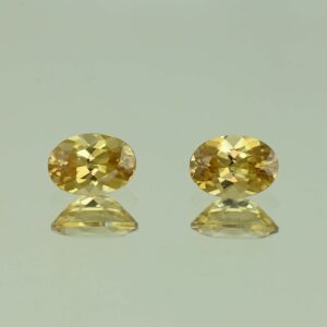 YellowZircon oval pair 7.1x5.1mm 2.34cts H zn3804